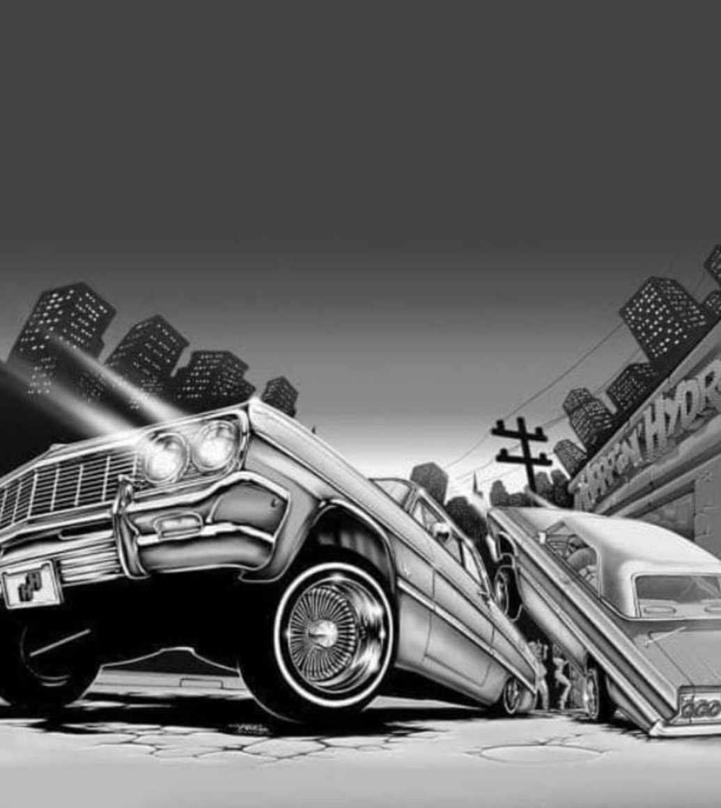 Classic lowriders on a city street at night — John 3:17 Ministries